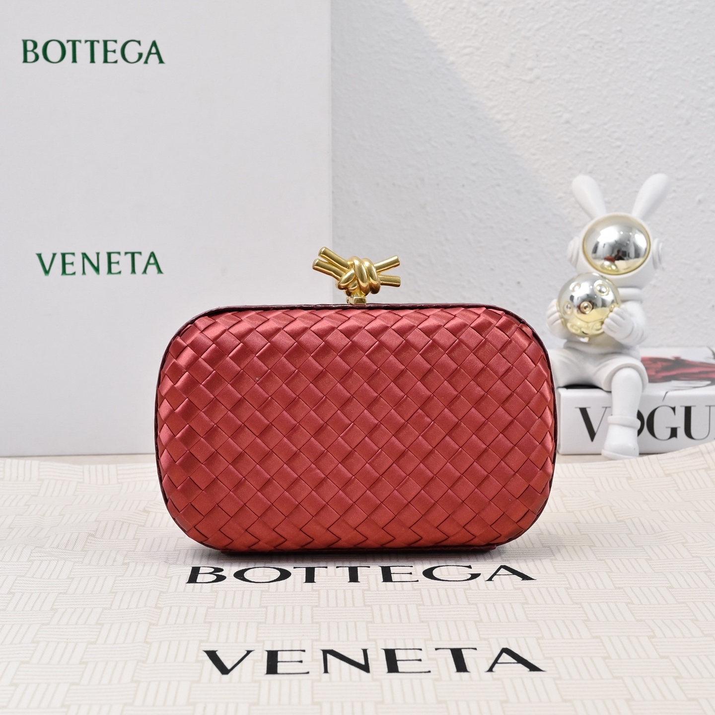 Bottega Veneta The Knot clutch in satin and python leather red