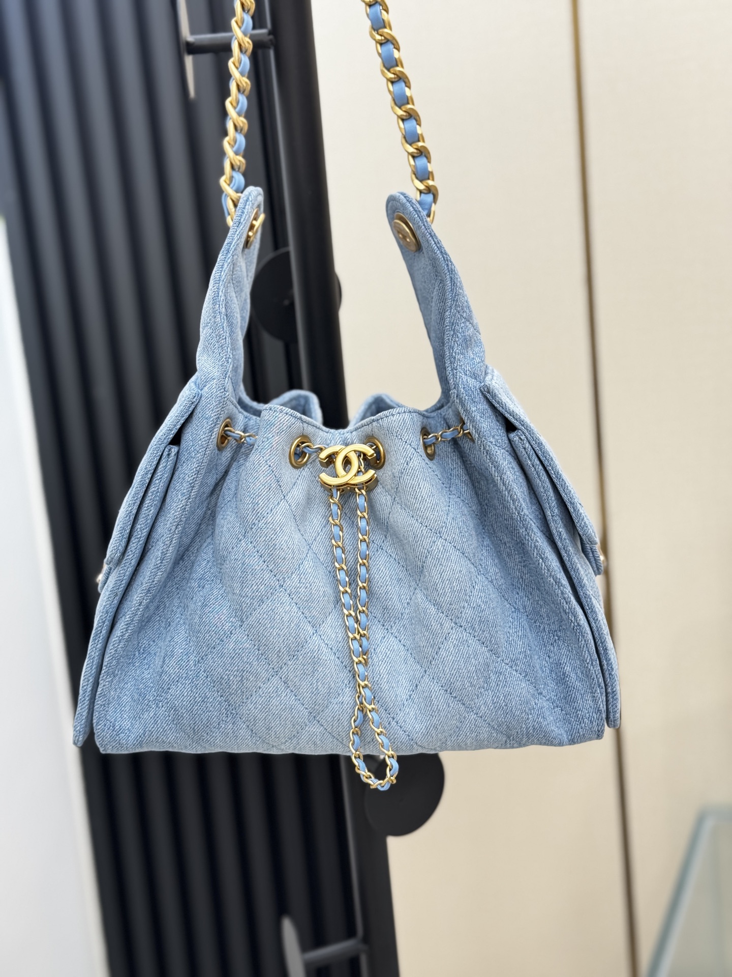 Chanel 25 medium handbag, Washed denim & gold-tone