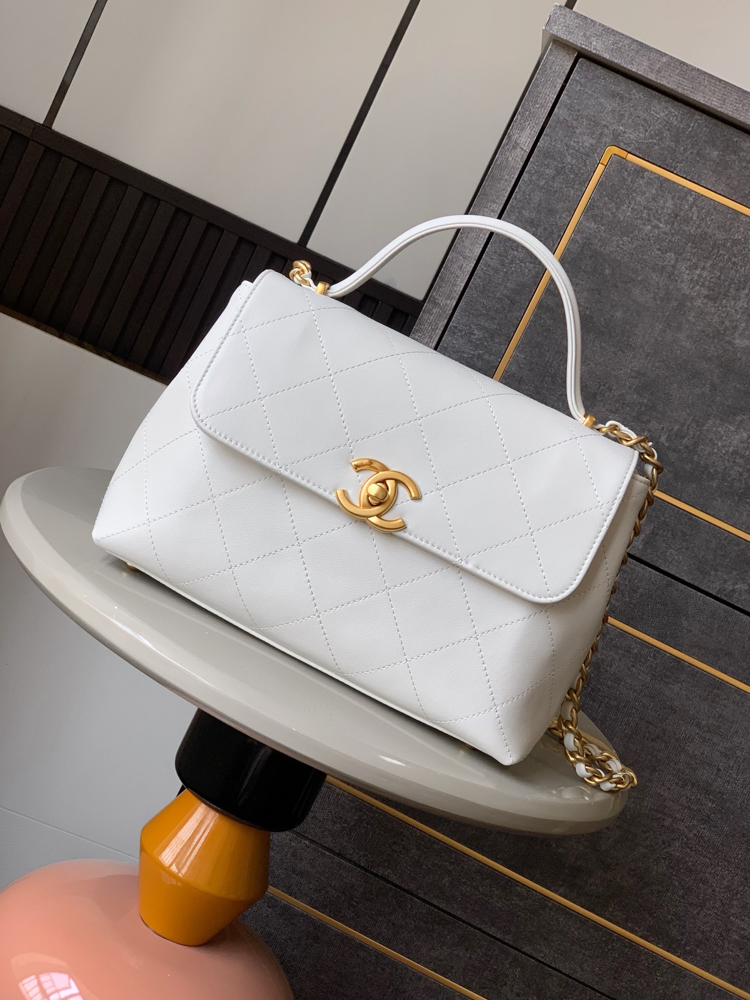 Chanel Maxi flap bag with top handle, Calfskin & gold-tone metal,