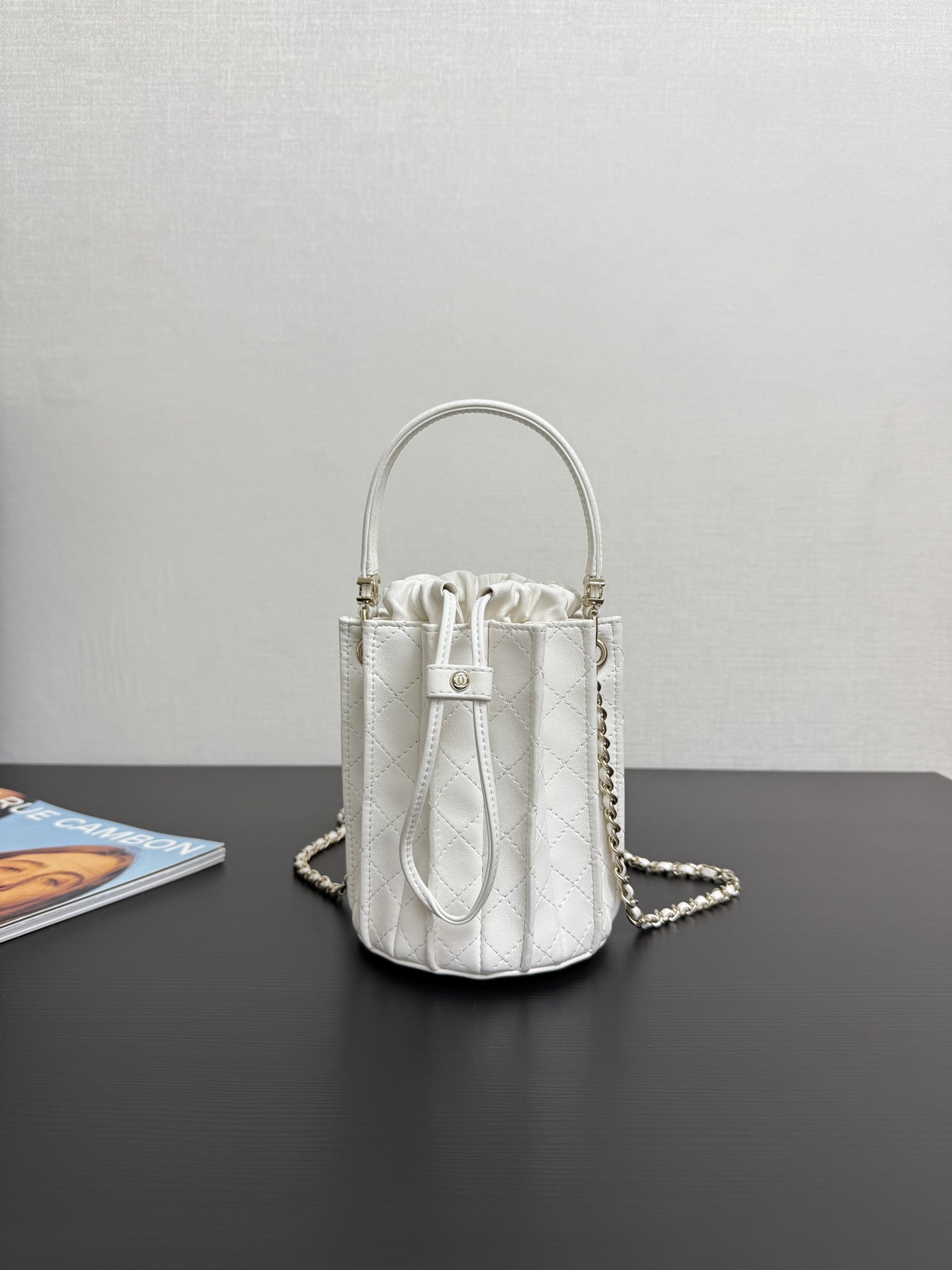 Chanel Mini bucket bag, Lambskin & gold-tone metal, white