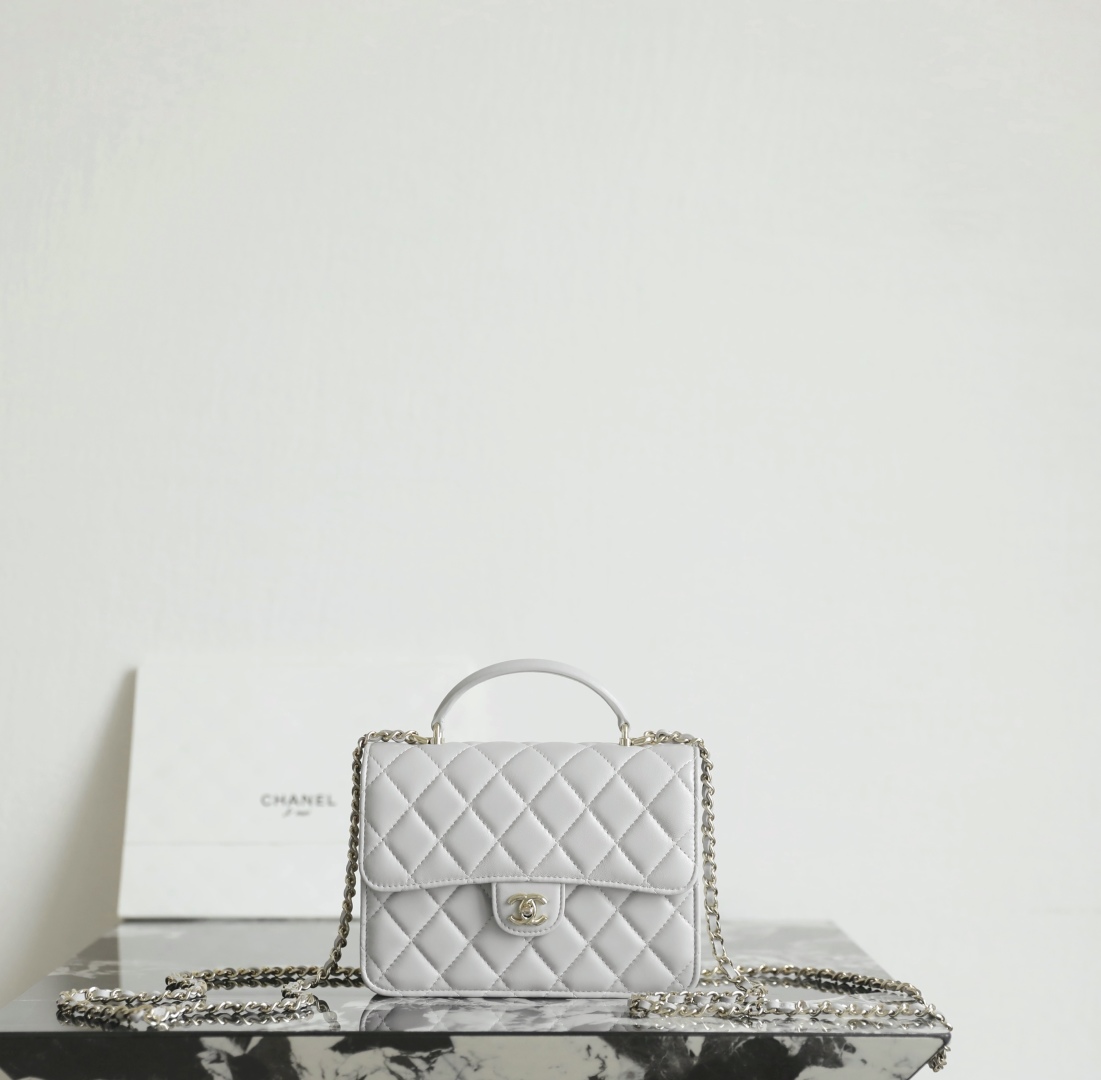 Chanel Mini flap bag with top handle, Lambskin & lacquered metal,