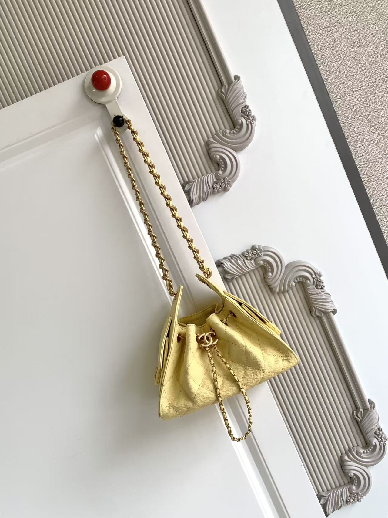 Chanel 25 small handbag, Grained calfskin & gold-tone metal, light yellow