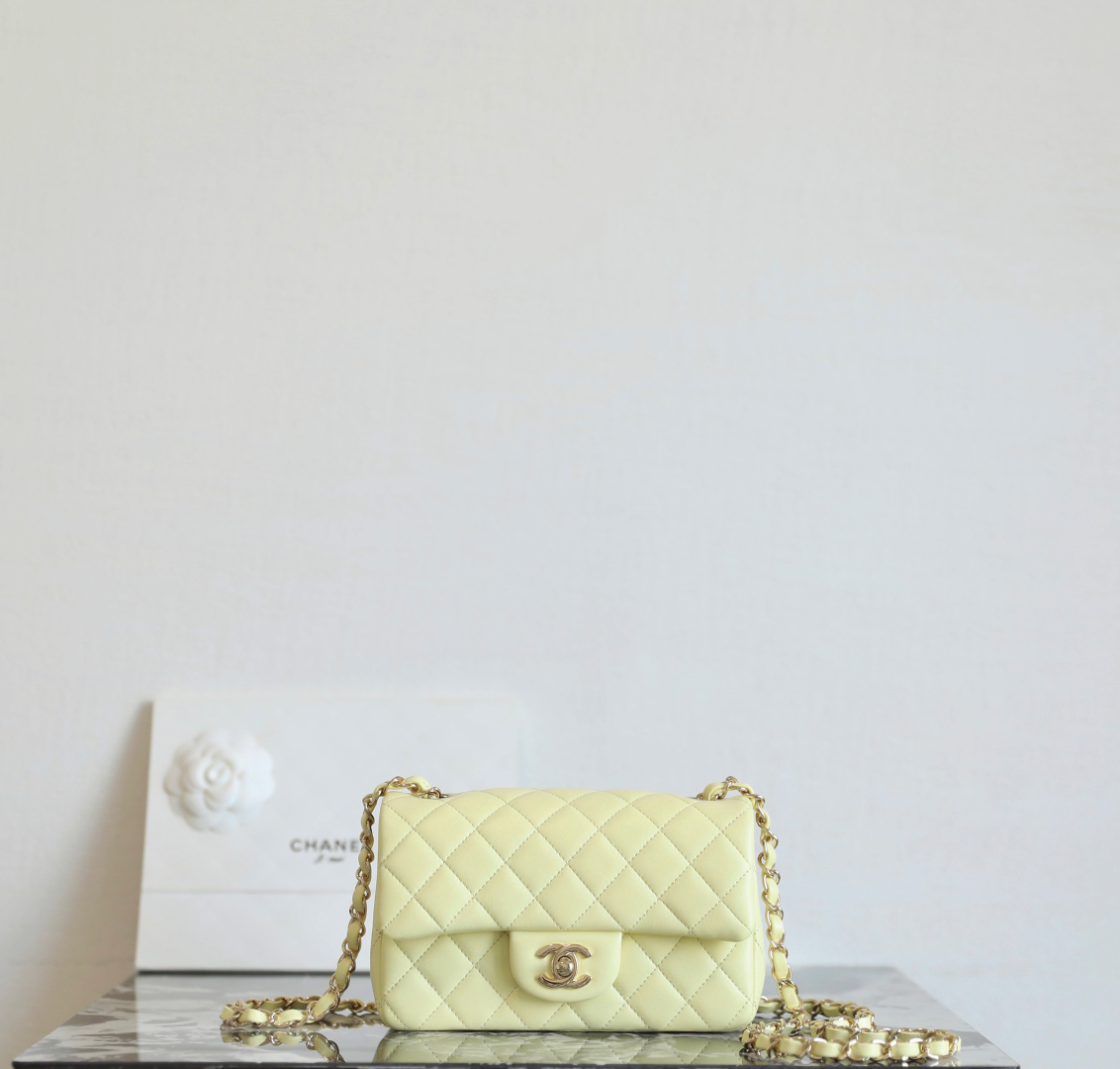 Chanel Mini classic handbag, Lambskin & gold-tone metal, light yellow