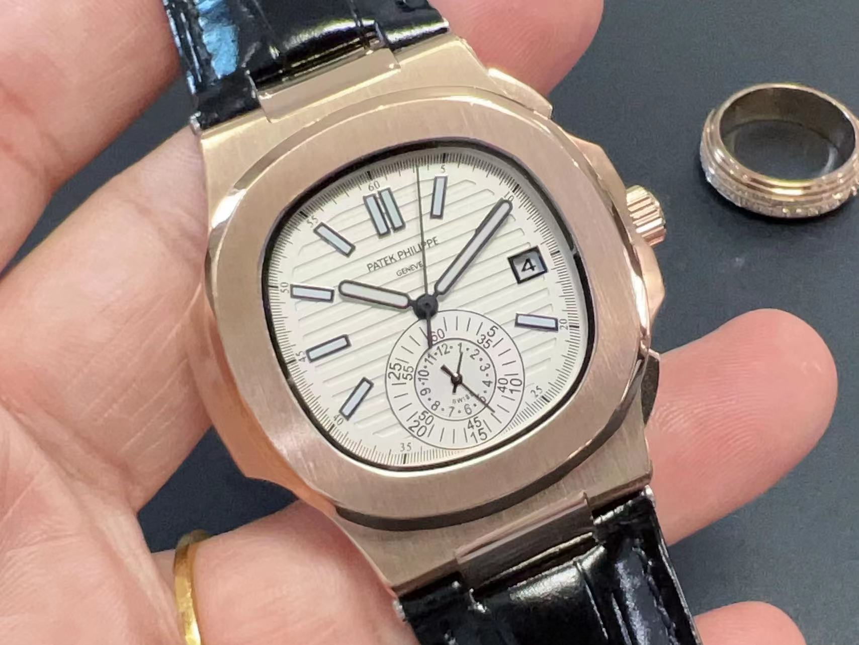 Patek Philippe 5980R-001 Nautilus Self-Winding black leather strap white dial