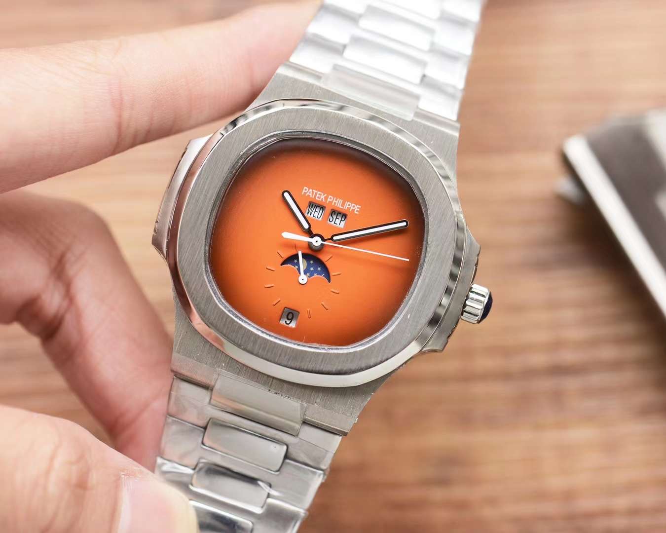 Patek Philippe Nautilus Automatic Men’s Watch – Moonphase, Month Display, Stainless Steel Bracelet dial Orange